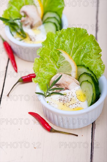 Fresh organic garlic cheese dip salad on a rustic table