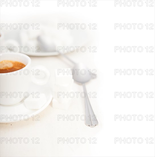 Italian espresso coffee fresh brewed macro closeup with sugar cubes