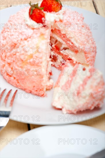 Fresh pink strawberry and whipped cream dessert macro close up