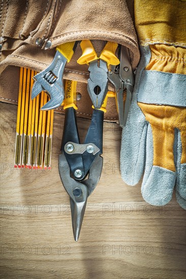 Building belt with construction tooling on wooden board