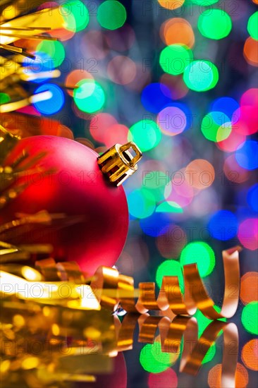 Christmas background red ball and tinsel on the background of the bokeh