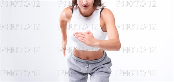 No name portrait. Sports woman runner on a white background. Photo of an attractive woman in fashionable sportswear. Dynamic movement. Side view. Sports and healthy lifestyle. Mixed media