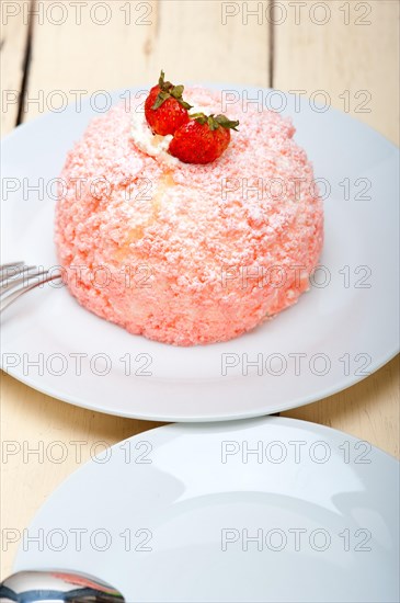 Fresh pink strawberry and whipped cream dessert macro close up