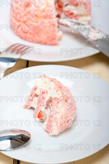 Fresh pink strawberry and whipped cream dessert macro close up