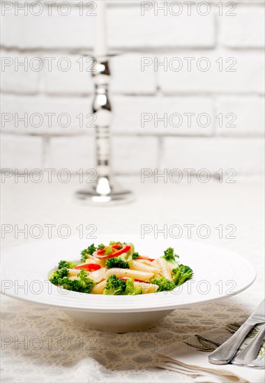 Classic Italian penne pasta with broccoli and red chili pepper