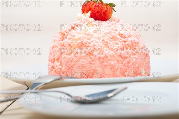 Fresh pink strawberry and whipped cream dessert macro close up