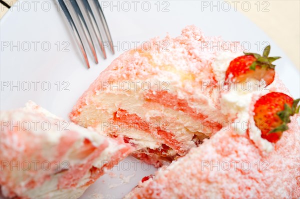 Fresh pink strawberry and whipped cream dessert macro close up