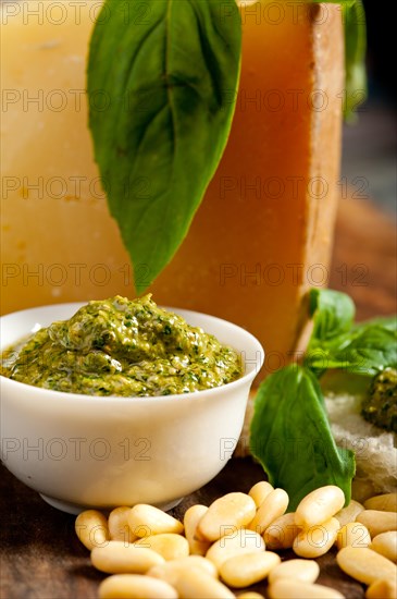 Italian basil pesto bruschetta ingredients over old wood macro