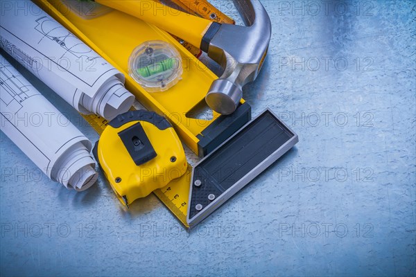 Stack of repair tools on an industrial metal background Design concept