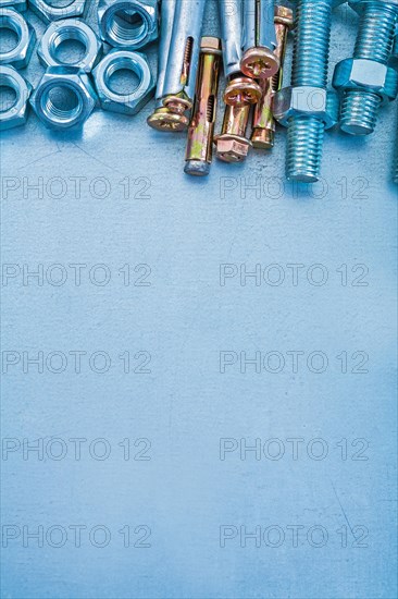 Metallic background with stainless steel anchor bolts