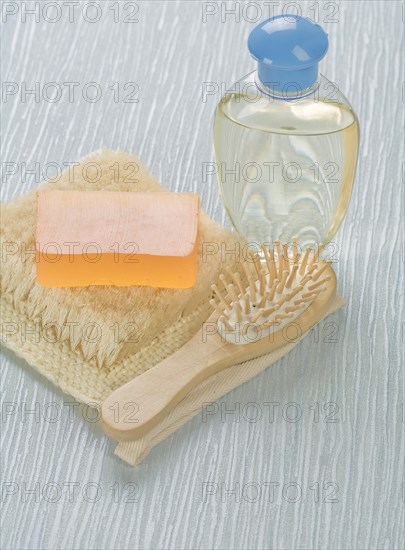 Bottle of hairbrush Soap and raffia