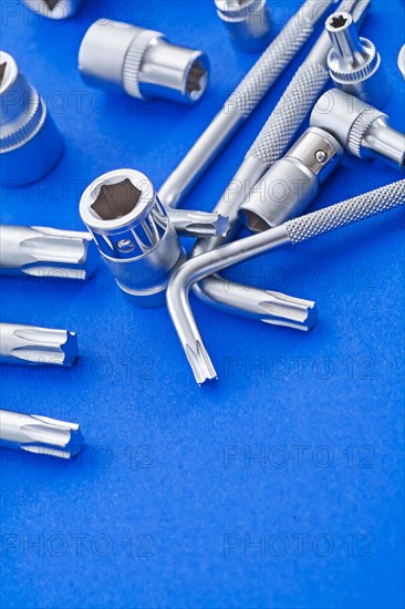 Copyspace image Torx and hexagon spanner on blue background