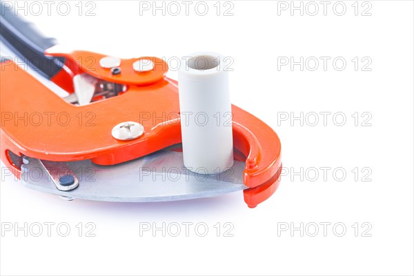 Insulated pipe cutter with plastical pipe close up