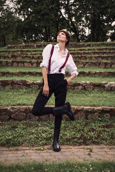 Image of a stylish beautiful woman in a white shirt