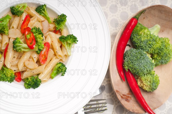 Classic Italian penne pasta with broccoli and red chili pepper