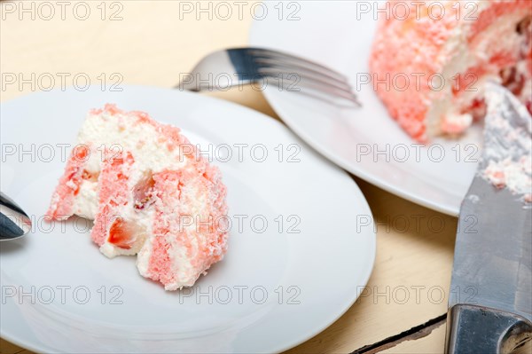 Fresh pink strawberry and whipped cream dessert macro close up