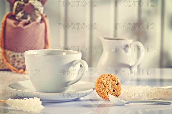 Composition of white coffee items on white table instagram style