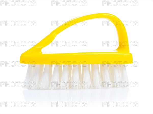 A yellow kitchen scrubber against a white background