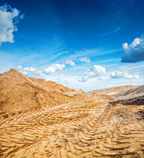 Large pile of building sand on the background of the sky