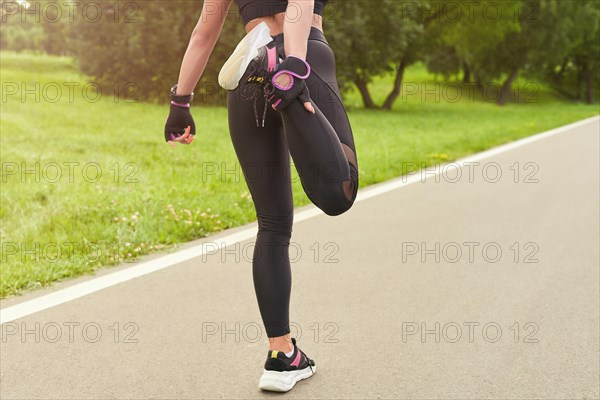 Image of a girl in the park doing a workout. The concept of a healthy lifestyle. Mixed media