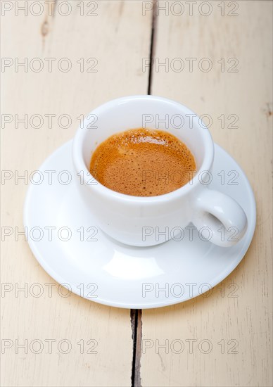 Italian espresso coffee over white wood table