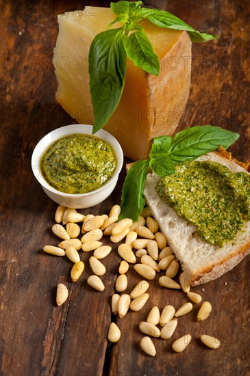 Italian basil pesto bruschetta ingredients over old wood macro