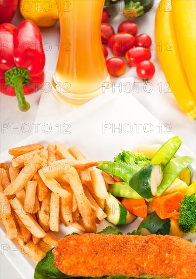 Fresh breaded chicken breast roll and vegetables