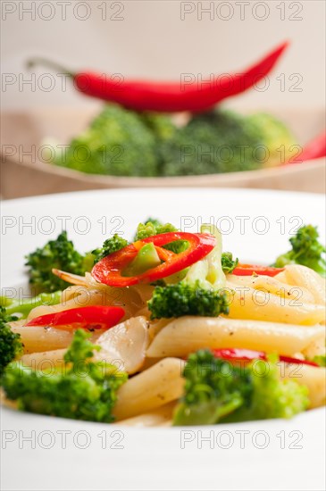 Classic Italian penne pasta with broccoli and red chili pepper