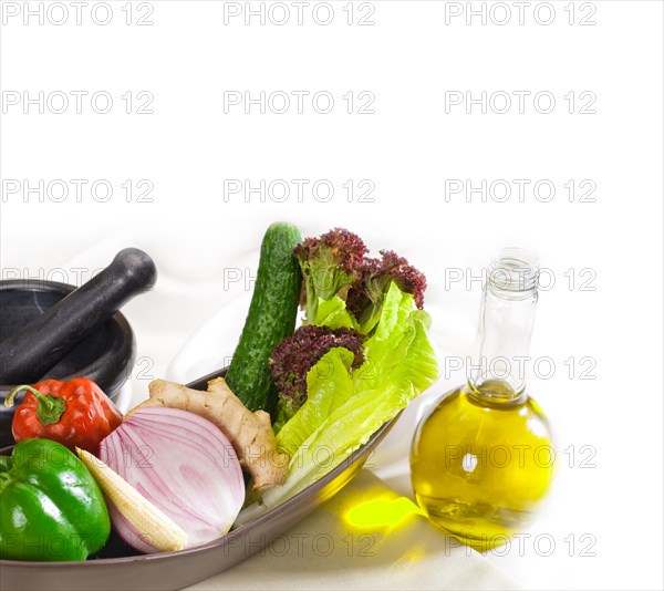 Assorted fresh vegetables and extra virgin olive oil