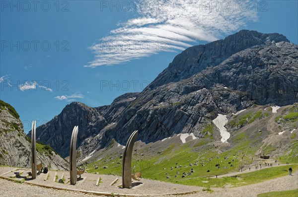 Mountain landscape with blue sky and foehn clouds