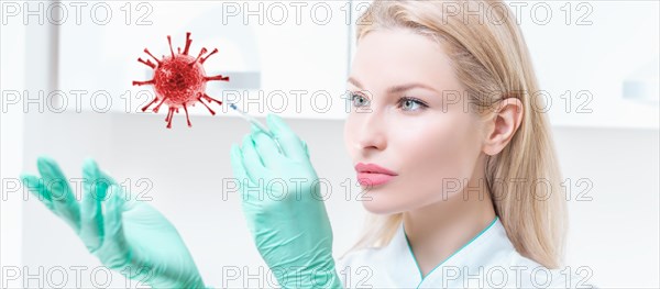 Portrait of a blonde girl in a medical gown with a syringe in her hands. Covid vaccine concept. Epidemic