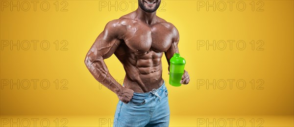 Isolated no name professional athlete on a yellow background. Bodybuilding concept. Panorama. Advertising of a gym and sports nutrition.