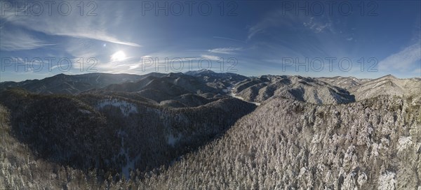 Aerial view of the Schneeberg over the snow-covered landscape near the chapel of the seven holy fathers