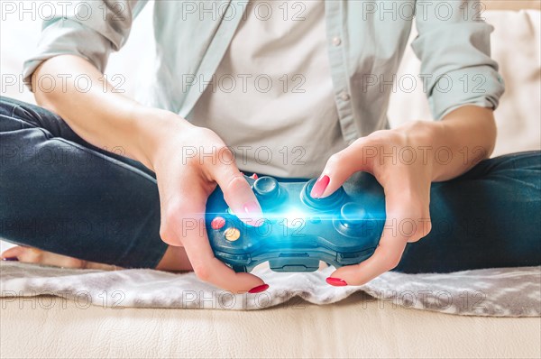 Image of hands holding a game joystick. Game concept. Stay home.