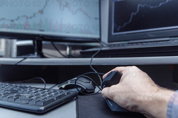 Man's hand uses a vertical ergonomic computer mouse-joystick