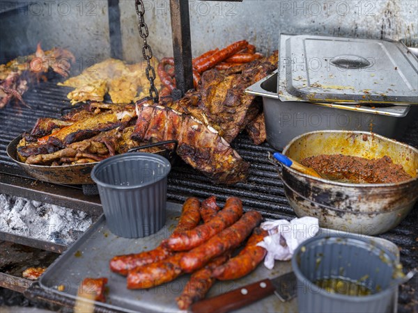 Meat and sausage on the street grill