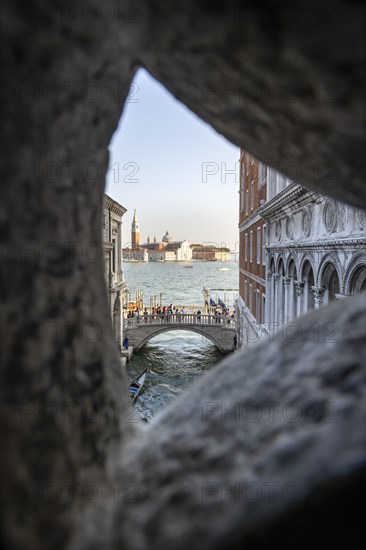 View from the Bridge of Sighs through a small hatch