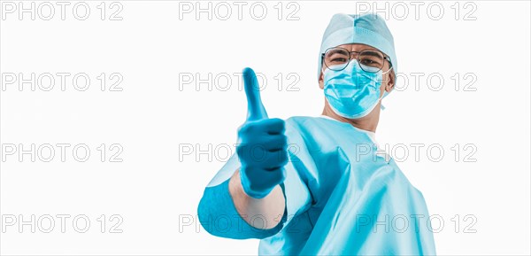 The doctor shows a raised finger up on a white background. Medicine concept.
