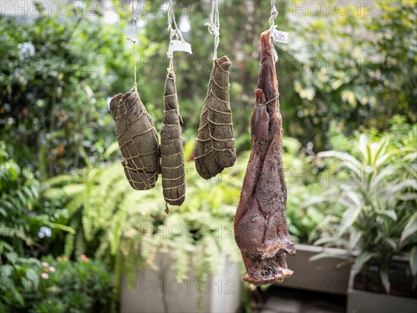 Llama shanks and leg of lamb over a smoker