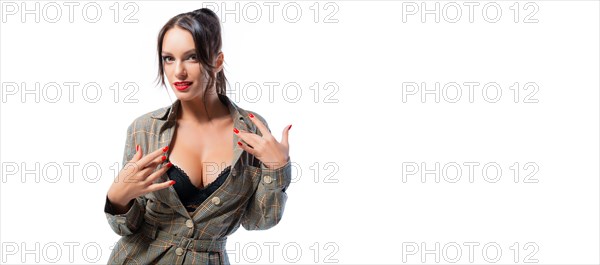 Sexy girl posing in the studio with an open neckline. Beautiful female breasts. Lingerie concept.