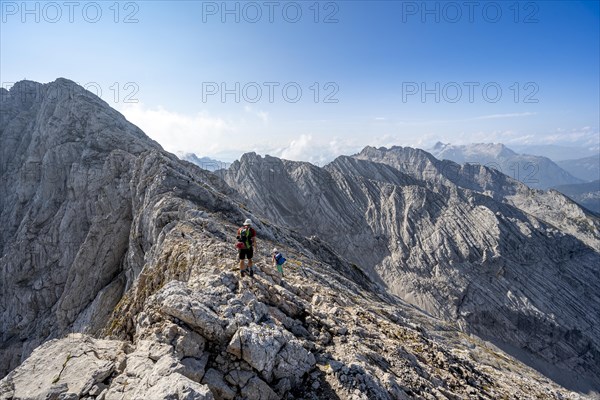 Mountaineer on a narrow ridge