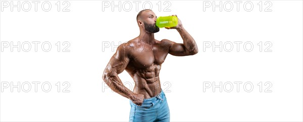 Athlete posing with a shaker in his hand on a white background. Fitness