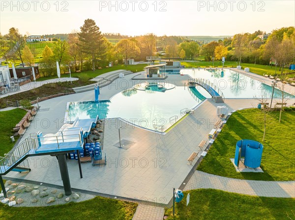 Drone shot of a fog-covered swimming pool at dawn