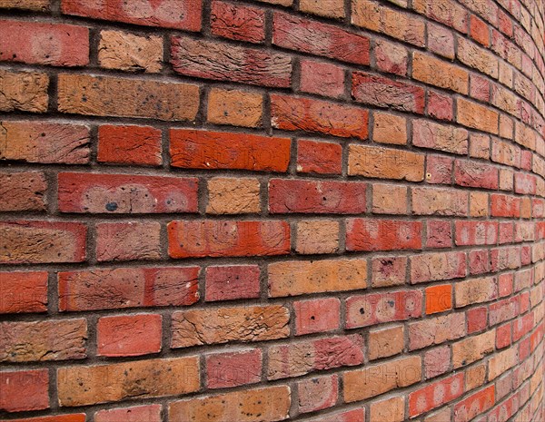 Curved red brick texture background in Town