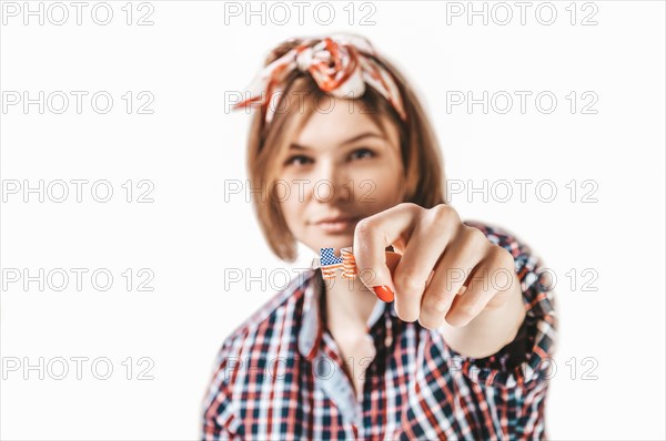 Portrait of a girl holding a puzzle with the USA flag. Concept of emigration