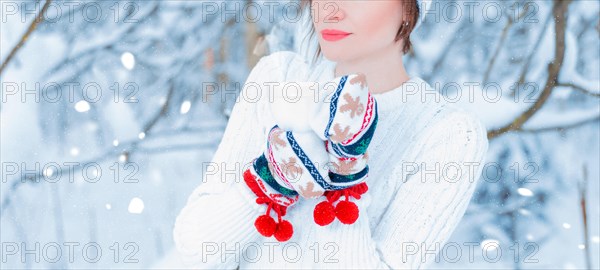 No name portrait of a girl on the background of a frosty winter morning with a cup in her hands. Winter vacation