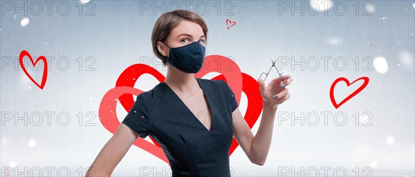 Portrait of an elegant beautiful girl with nail scissors in her hand. The concept of gift certificates for beauty salons. Winter background. Valentine's Day.