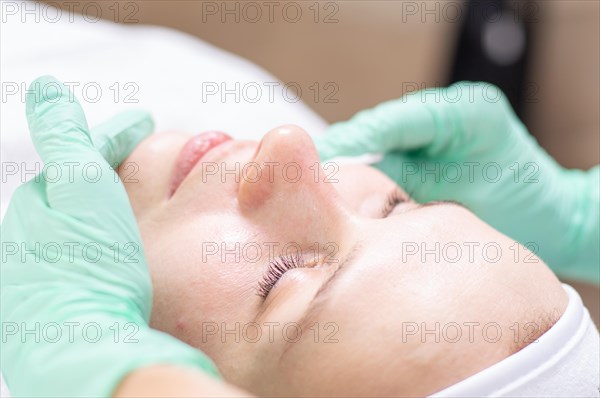 Portrait of a woman's face with problem skin. Peeling procedure. Natural beauty.