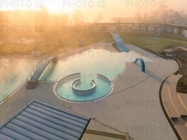 Aerial view of a swimming pool with water slide