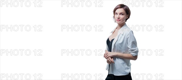 Portrait of stylish adult woman posing in studio over white background. Mentoring and coaching concept